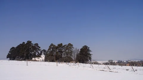 White church built in the middle of a pine envelope, from the end-field cover Stock Footage 96711547