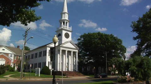 White church on main street in small town America Stock Footage