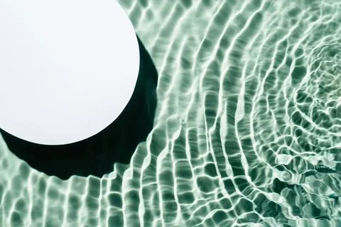 White circle copy space in transparent green blue water drop splashing gel Stock Photos