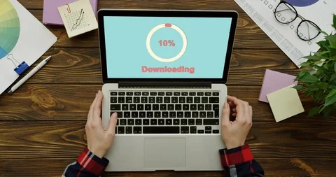 White circle of red percents loading in the blue screen of the laptop computer Stock Footage 95049524