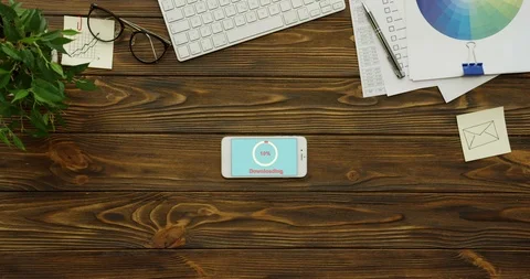 White circle of red percents loading in the blue screen of the smartphone which Stock Footage 95054756