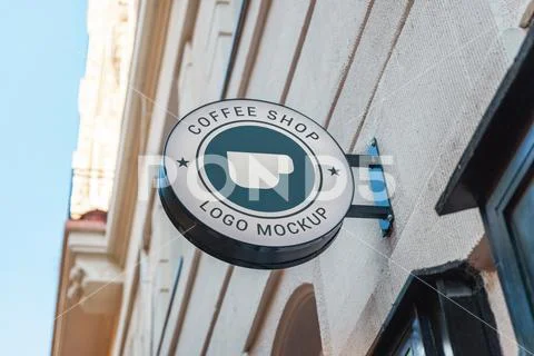 White circle signage mockup above shop entrance Template PSD