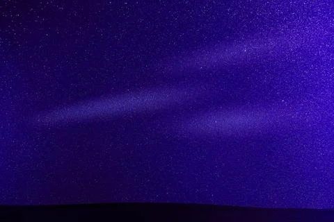 White circles of light on a colored background Stock Photos