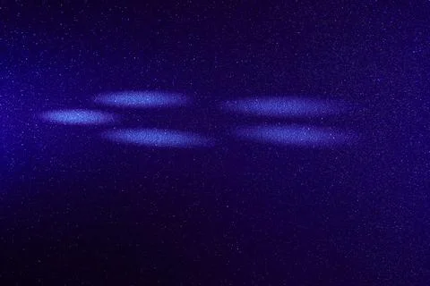 White circles of light on a colored background Stock Photos