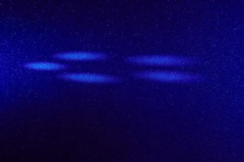 White circles of light on a colored background Stock Photos