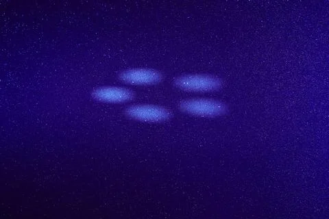 White circles of light on a colored background Stock Photos