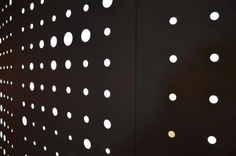 White circular lights on a wall or background Stock Photos