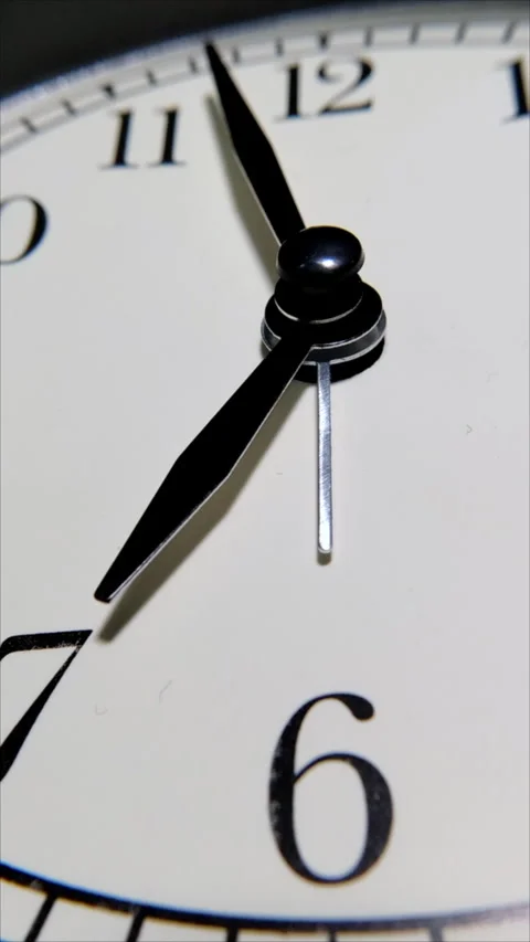 White Circular Wall Clock Counting Down Time. Vertical. Stock Footage 284833499