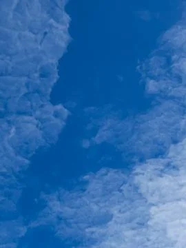 White Cirrocumulus Clouds in Clear Blue Sky Stock Photos