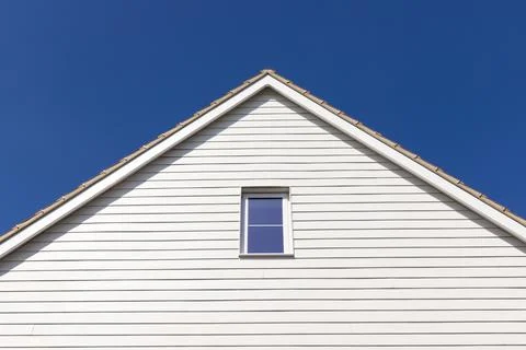 White cladding on the side of a house. Stock Photos
