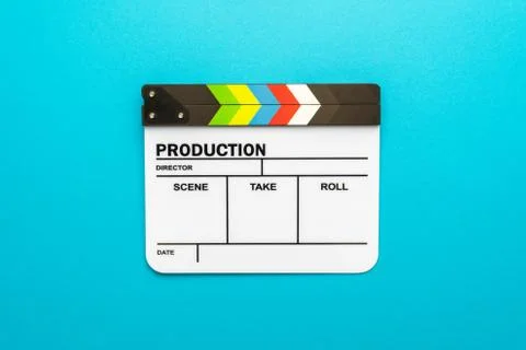 White clapperboard as filmmaking concept on turquoise blue background copy space Stock Photos