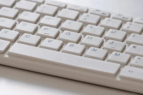 White classic keyboard for computer background close-up. Keys with letters of Stock Photos