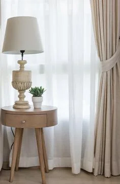 White classic lamp on table side in bedroom with at home Stock Photos