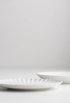 White clean empty tableware: plates on white background for a dessert Fotos de archivo