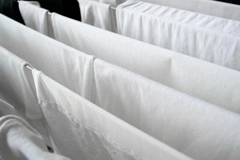 White clean laundry drying after washing. The concept of washing clothes Foto stock