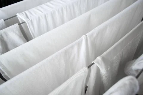 White clean laundry drying after washing. The concept of washing clothes Stock Photos