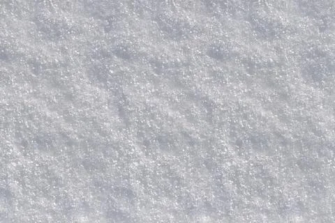 White clean snow background texture. Texture of white snow. Snow surface. Stock Photos