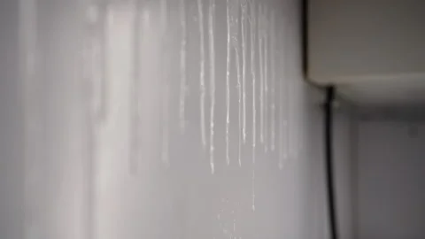 White cleaning foam dripping down kitchen wall during cleaning or disinfection Stock Footage 305993929