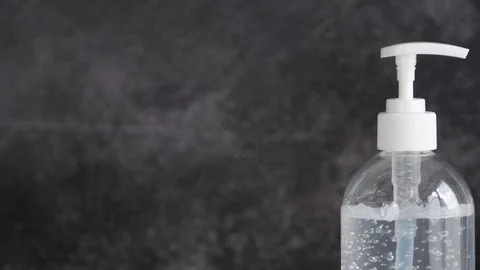 A white clear plastic bottle with transparent hand sanitizer gel isolated on Stock Footage 128331054