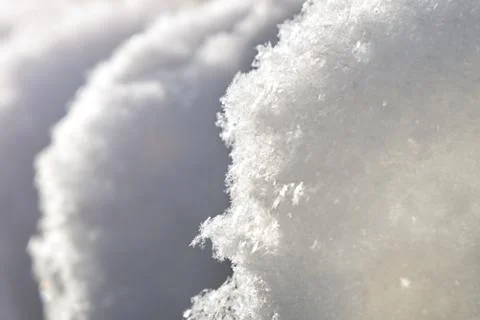 White clear snow caps back lit by the morning sun close up Foto stock