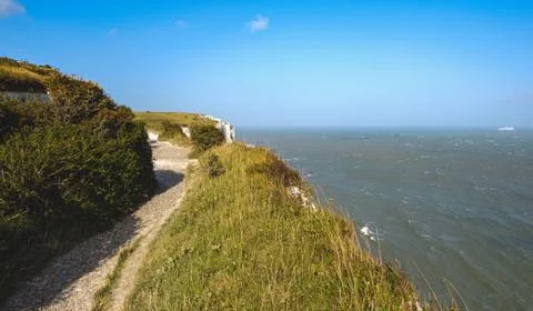 White cliffs of dover grass clear sky sea england Stock Photos