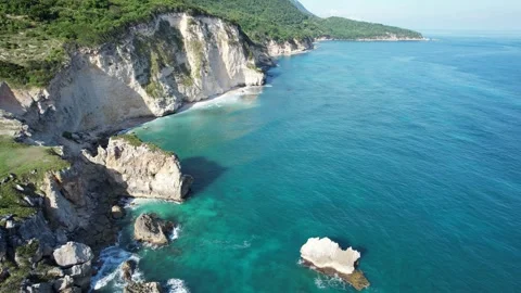 White cliffs plunging into deep blue ocean, wide aerial view Stock Footage 278368636