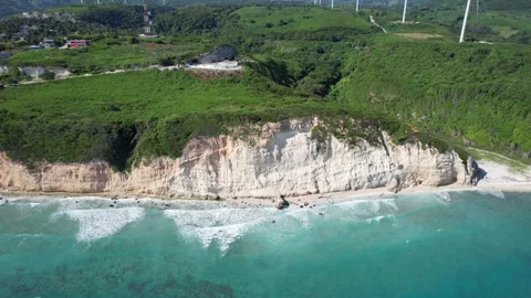 White cliffs with a small village overlooking the ocean, aerial view Stock Footage 278369448
