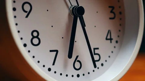 The White Clock With Black Arrows Shows The Time Six Hours Timelapse. Stock Footage 120033951