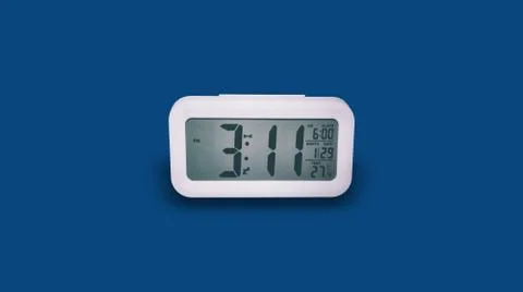 White clock with blue background Stock Photos