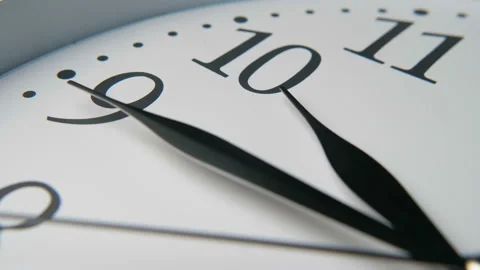 White clock dial with three long black hands pointing fifteen minutes to ten Stock Footage 116551065