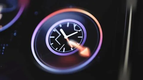 White clock face sits behind orange forward arrow Stock Photos