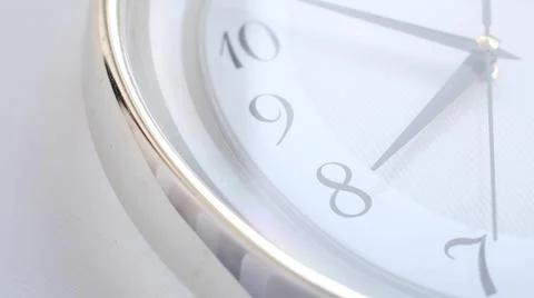 White clock face ticking. Close-up soft focus. Stock Photos