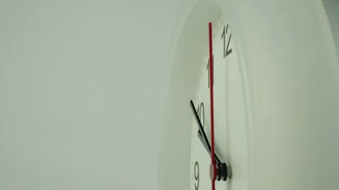 White clock hanging on home wall showing time. Stock Footage 230114678
