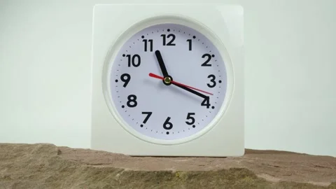 White clock located on stone table in house. Stock Footage 230114668