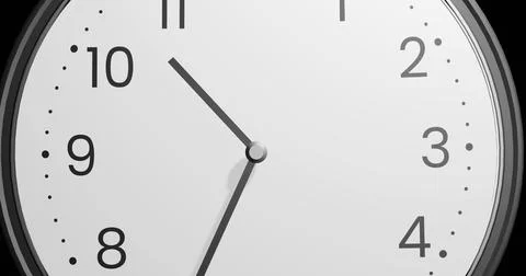 White clock showing 10 35 o'clock on white background Stock Photos
