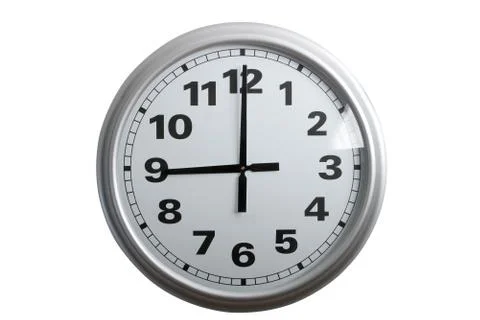 White clock showing 9 o'clock on white background Stock Photos