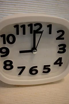 White clock showing 9 o’clock Photos