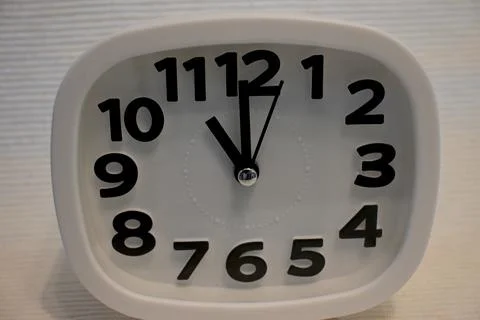 White clock showing eleven oclock with copy space Fotos Stock