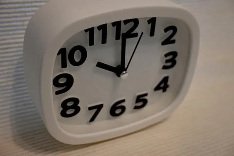 White clock showing ten oclock with copy space 库存照片