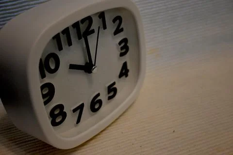 White clock showing ten oclock with copy space Фото