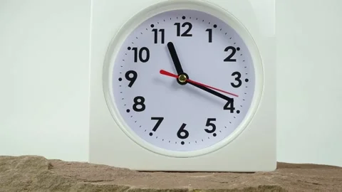 White clock on stone table. Stock Footage 230114699
