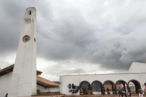 White clock tower with colonial arc structure at Guatavita colombian town Stock Photos