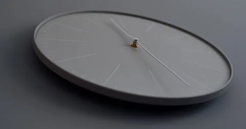 A white clock on the wall above the house. Slow motion. Stock Footage 145898702