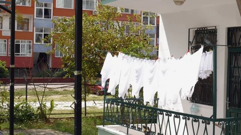 White clothes dry on the balcony Stock Footage 108772246