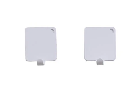 White clothes hooks on the door, copy space, isolated on a white background Stock Photos