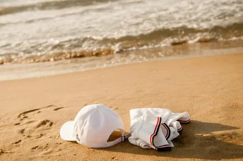 White clothes lying on the sand without people Photos