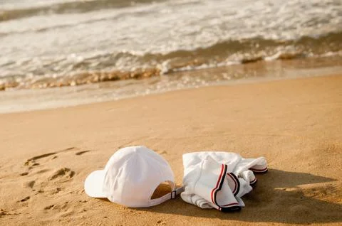 White clothes lying on the sand without people Photos