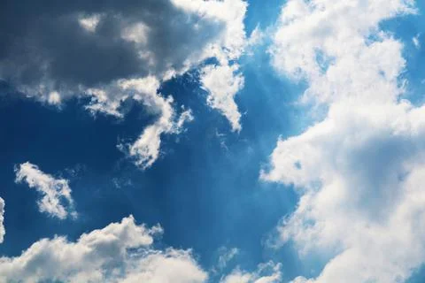 White cloud and sunlight shining and pass on blue sky Stockfoto's