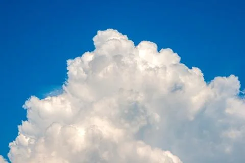 White cloud on a blue background. Horizontal photography. Stock Photos