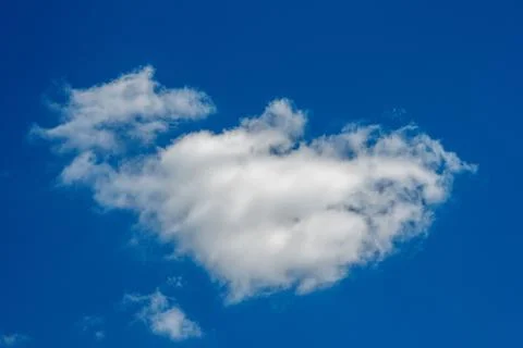White cloud on a blue background. Horizontal photography. Stock Photos